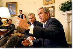 President George W. Bush and Polish President Aleksander Kwasniewski meet with the media in the Oval Office Jan. 14, 2003. White House photo by Paul Morse.