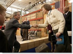 President George W. Bush greets employees at JS Logistics in St. Louis, Mo., after discussing his economic stimulus package Wednesday, Jan. 22, 2003. "It's important for our fellow Americans to understand that the strength of our country, the strength of our economy really depends upon the strength of the small business community all across America. And that's why I'm here today in this small business, to remind people about the importance of small business," President Bush said. White House photo by Paul Morse.