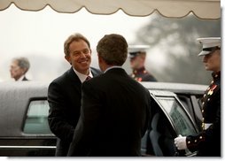 President George W. Bush welcomes British Prime Minister Tony Blair upon his arrival to the White House Friday, Jan. 31, 2003. White House photo by Paul Morse.