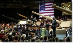 President George W. Bush addresses employees of the Lima Army Tank Plant, where the Abrams M1A2 tank is built, in Lima, Ohio, April 24, 2003. "I'm here to thank you all for your service to our country, and thank you for the vital contribution you have made to peace and freedom," said the President in his remarks. "And each of you have had a part in this mission. Each of you are a part to making sure this country is strong enough to keep the peace." White House photo by Paul Morse.