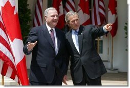 President George W. Bush and Canadian Prime Minister Paul Martin respond to questions from the press corps in the Rose Garden after a meeting at the White House on April 30, 2004. White House photo by Paul Morse.